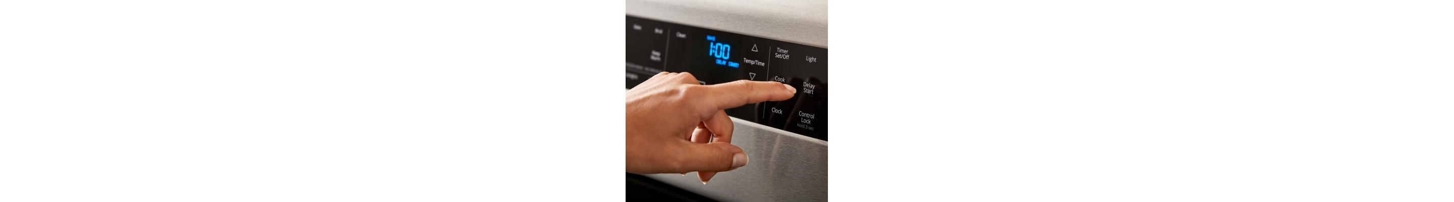 Person selecting a cook setting on a Whirlpool® Range
