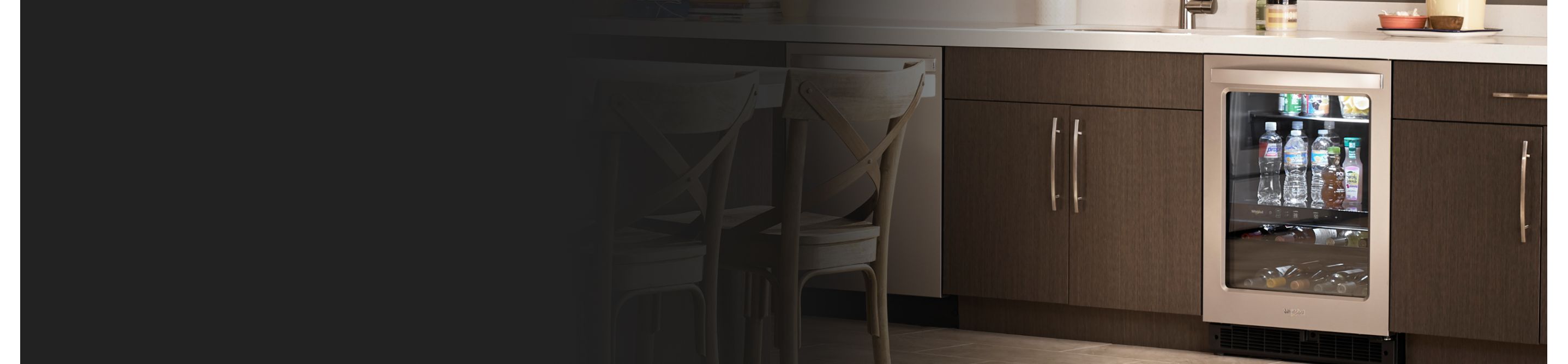 Interior of a kitchen with an undercounter fridge installed