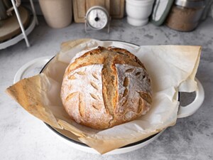 Sourdough dough bread in a white dutch oven