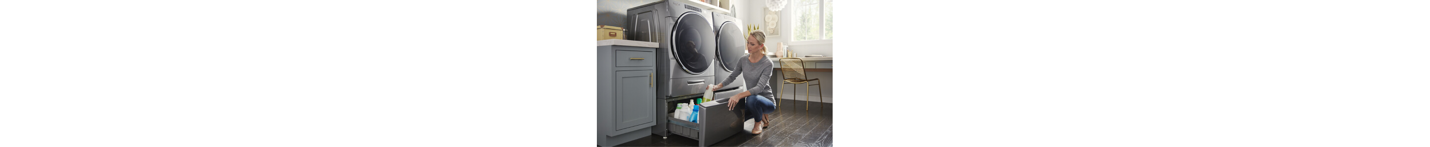 A woman putting away cleaning supplies in a laundry pedestal
