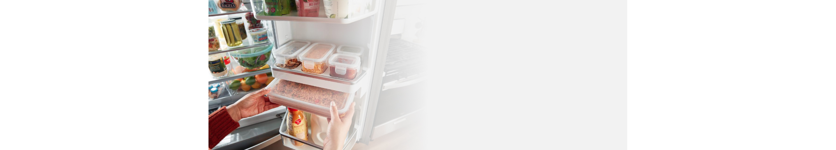 Person removing built-in storage containers from fridge
