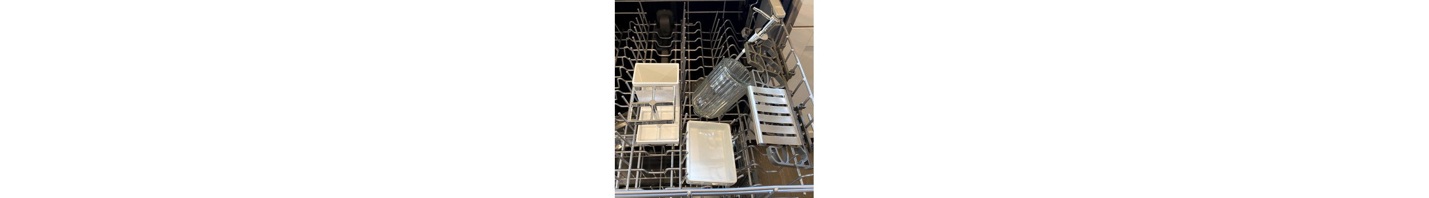 Bathroom accessories on the top rack of a dishwasher
