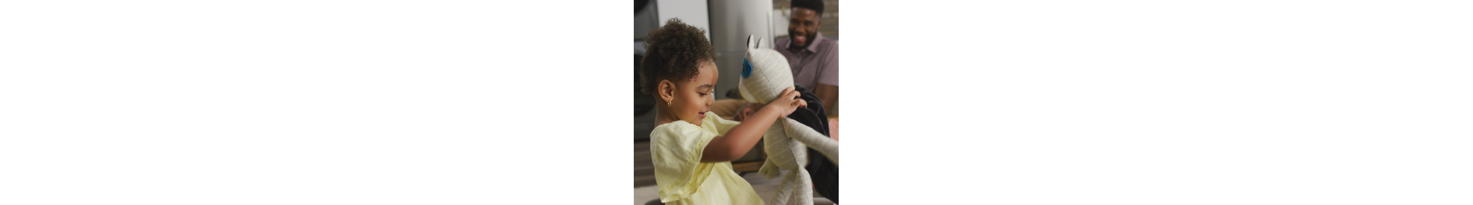 Child playing with stuffed toy