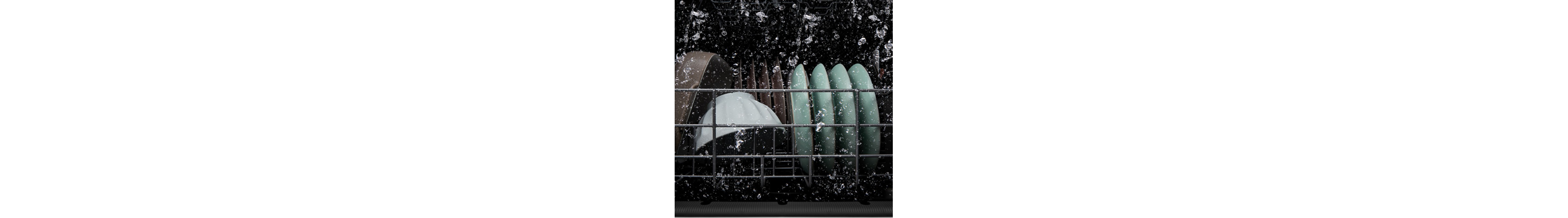Dishes getting washed inside a dishwasher