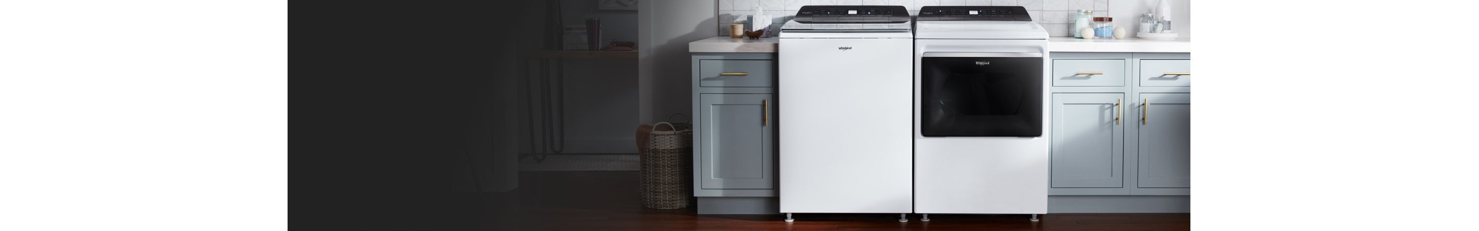 White Whirlpool® Top Load Washer & Dryer next to cabinets