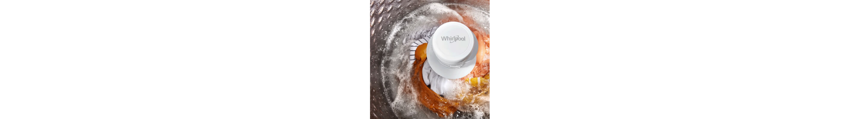 Interior of a Whirlpool® Washer with an agitator washing orange, white and yellow garments