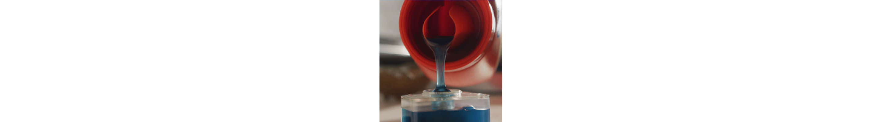 Close up of laundry detergent being poured into a cup