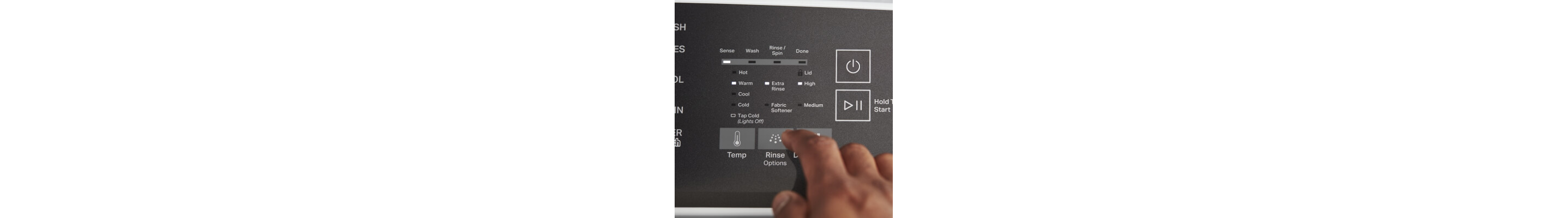 Close up of a person selecting a washer setting on the control panel of a Whirlpool® Washer