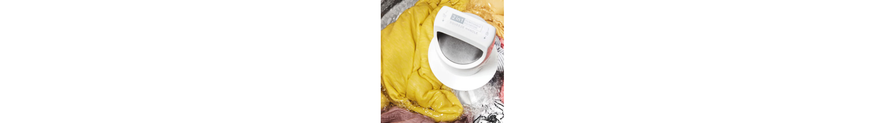 Interior of a Whirlpool® Washer with an agitator washing yellow, gray and white garments