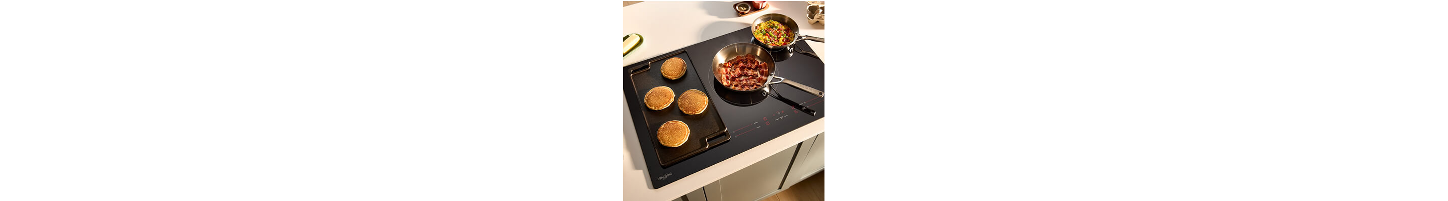 Breakfast cooking on an electric cooktop with griddle accessory