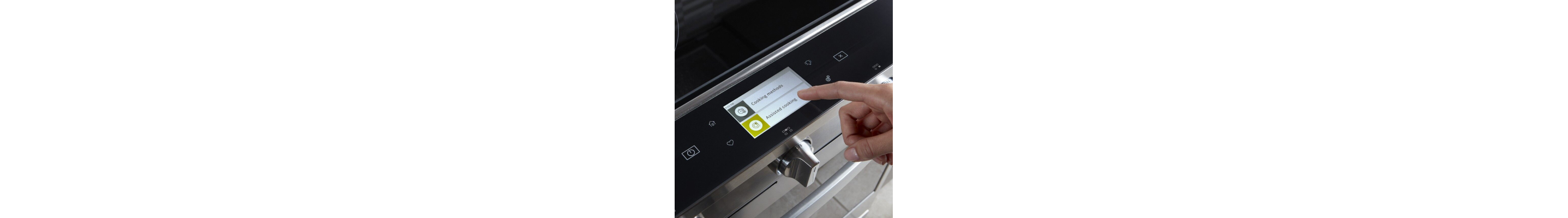 Person selecting a cook setting on a Whirlpool® smart oven