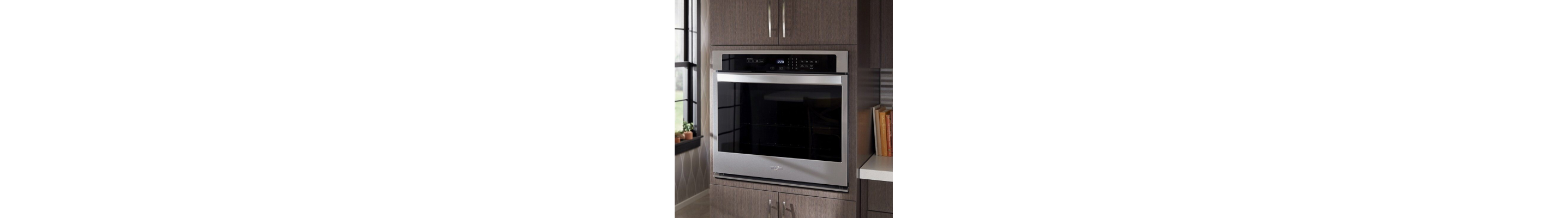 Stainless steel Whirlpool® wall oven in a modern kitchen