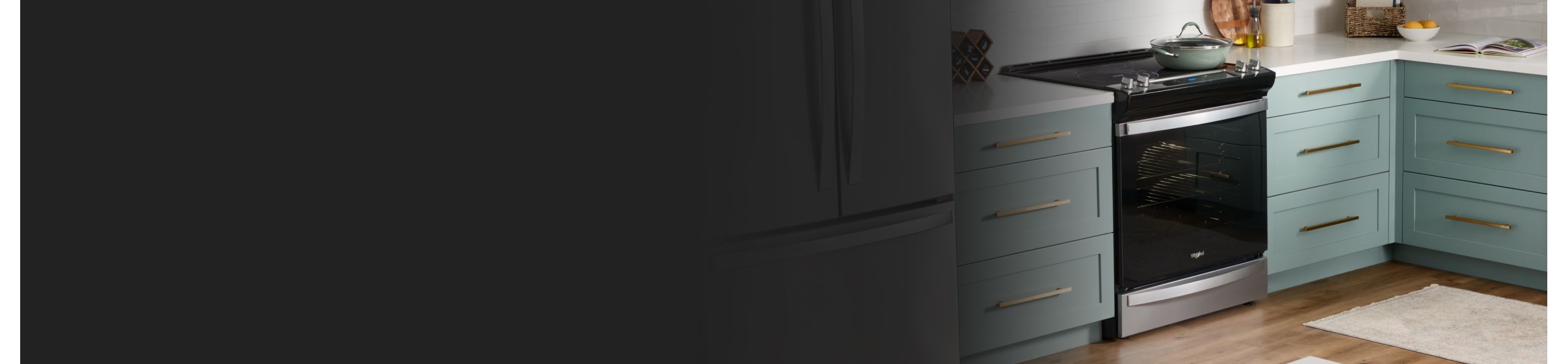 Whirlpool® electric range in a kitchen with teal cabinets