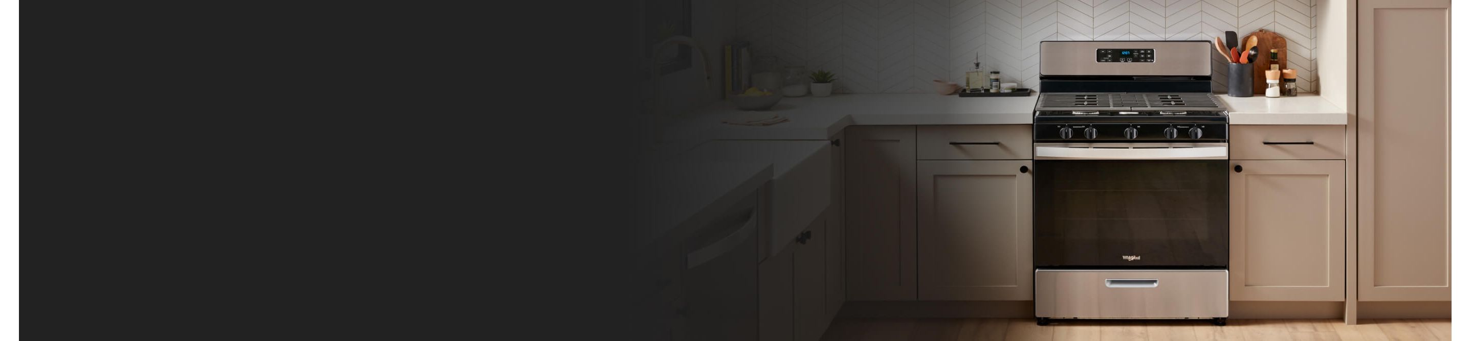 A Whirlpool® Range surrounded by tan cabinetry