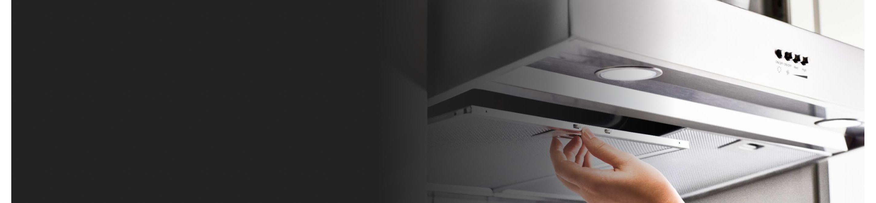 A hand removing the filter on a Whirlpool® Range Hood