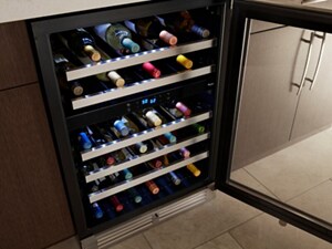 A beverage center filled with wine
