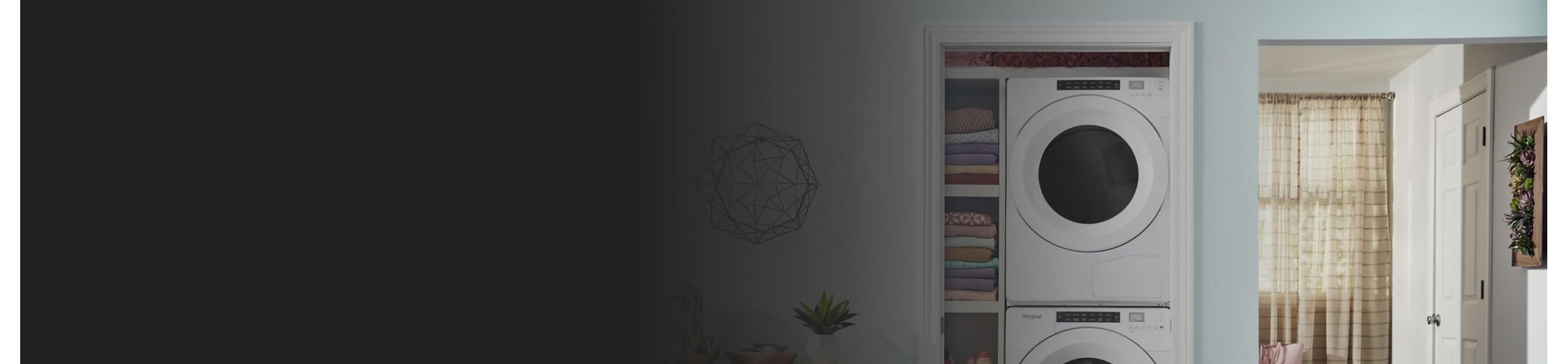 White Whirlpool® Stacked Washer and Dryer in a laundry closet