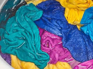 Colorful, wet laundry in a washing machine