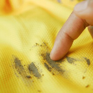 A close-up of a muddy sports jersey