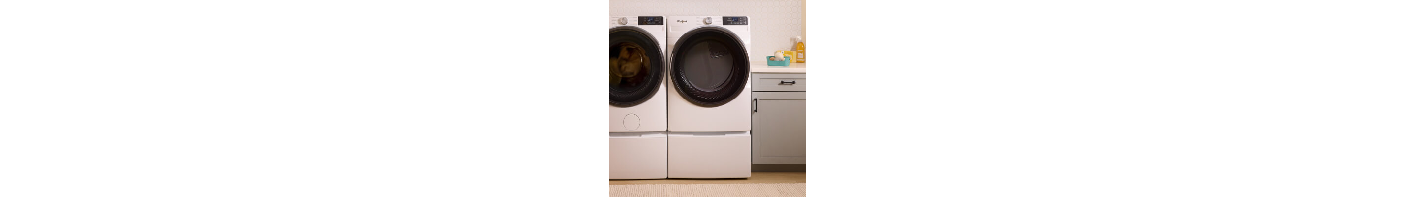 A Whirlpool® Front Load Dryer next to a Whirlpool® Front Load Washer