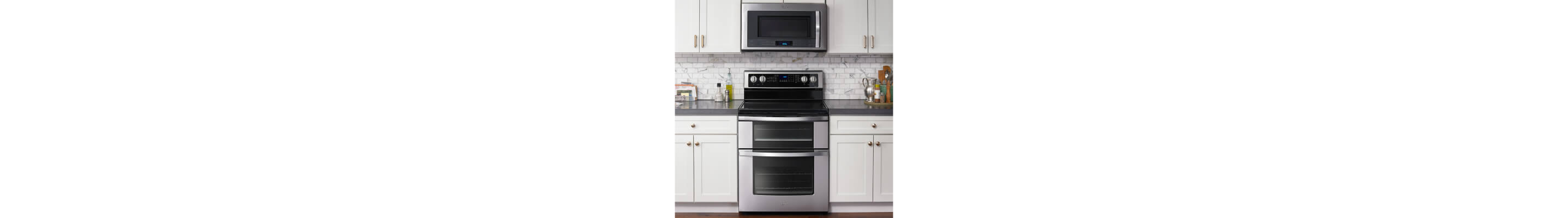 Double oven set in white cabinetry