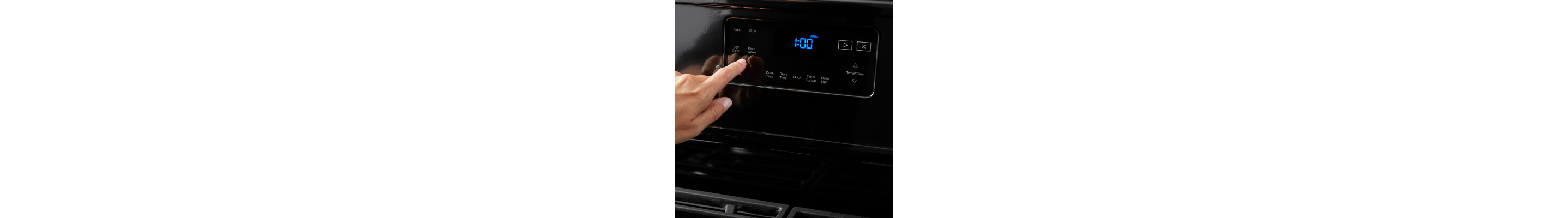 A person making a selection on a self-cleaning range