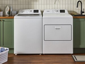 A white Whirlpool® Washer and Dryer pair in a laundry area