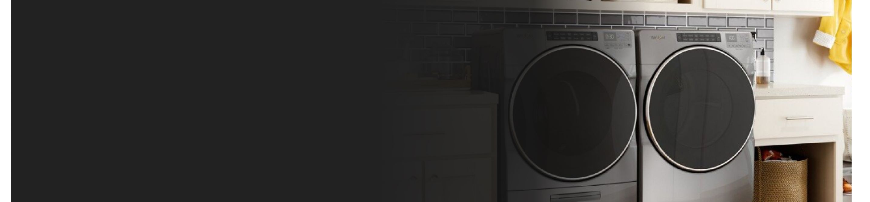 Front load chrome washer and dryer in a laundry room