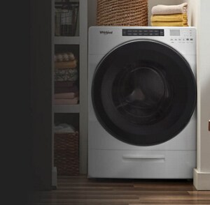 White all-in-one washer combo in a closet