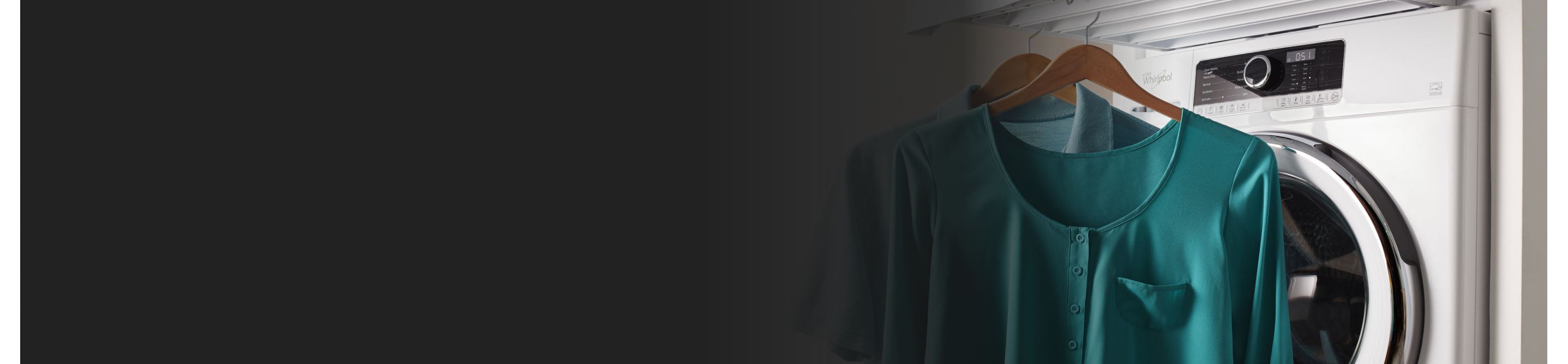 Two freshly dried shirts hanging in front of a Whirlpool® washing machine