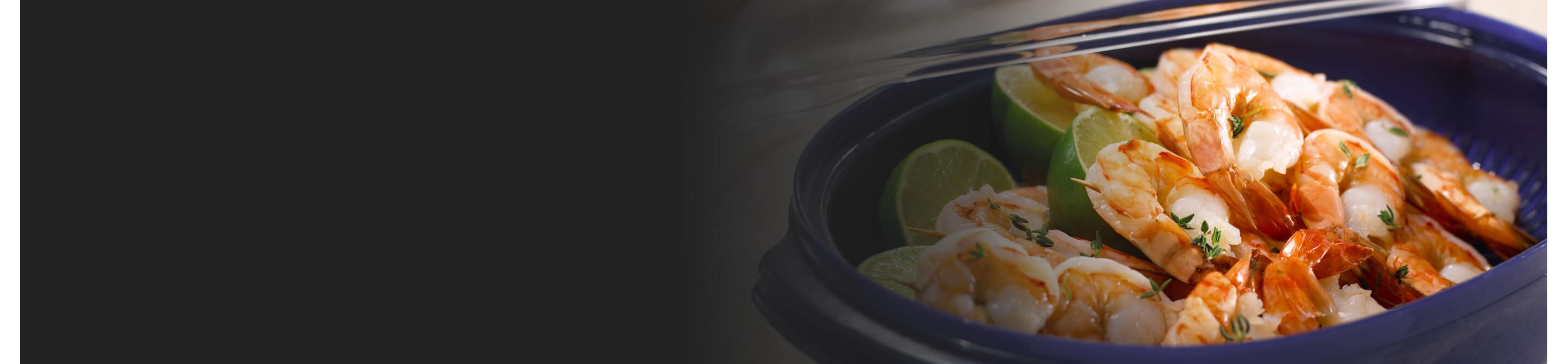 Steamed shrimp with herbs and lime in a blue dish