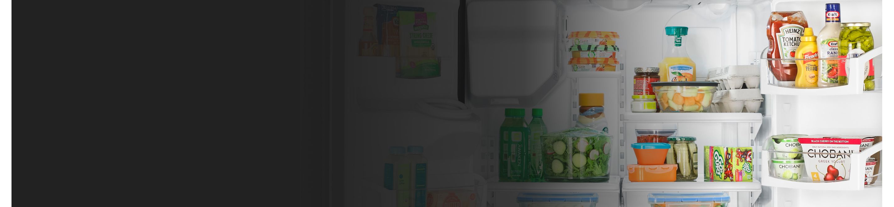 A Whirlpool® refrigerator loaded with a variety of foods