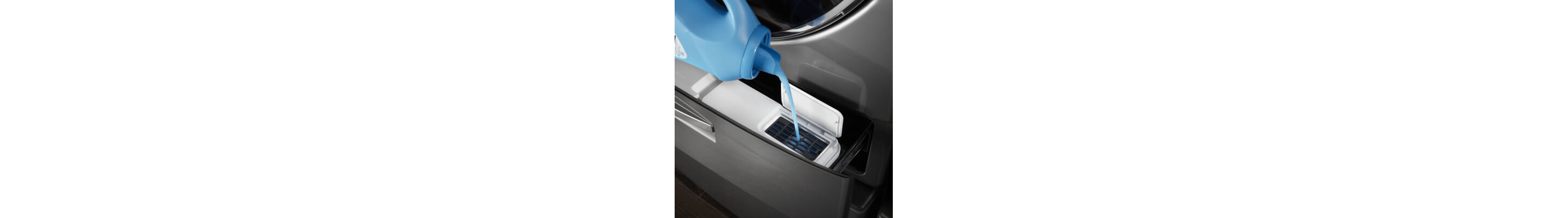 Fabric softener being added to the inside of the washer