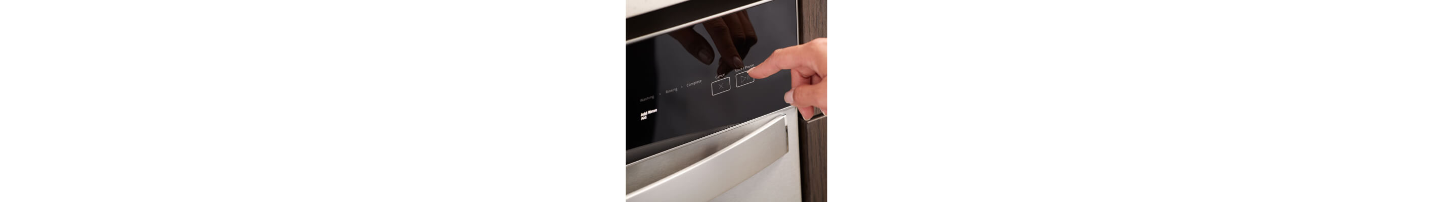 Person selecting a wash cycle on a Whirlpool® dishwasher