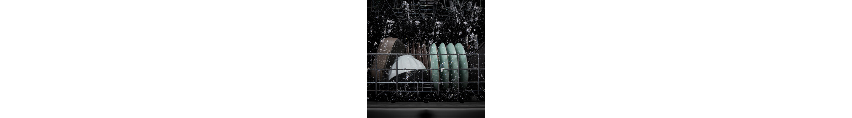 Dishes being washed inside a dishwasher