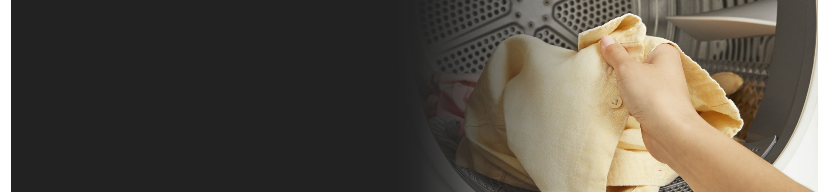 Person removing shirt from dryer