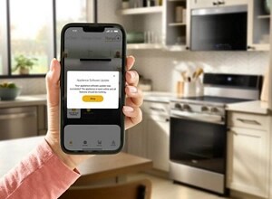 A hand holding a phone with the Whirlpool® App pulled up