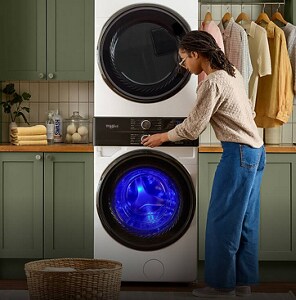 Person selecting a cycle on their Whirlpool® Laundry Tower
