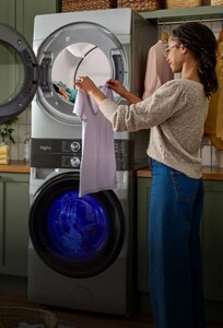 A person unloading a washing machine