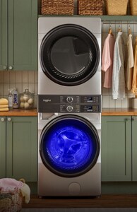 A stacked laundry set in a laundry room