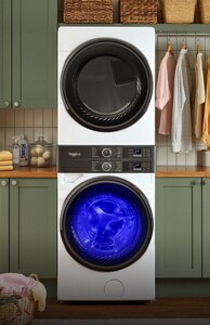 A stacked laundry set in a laundry room