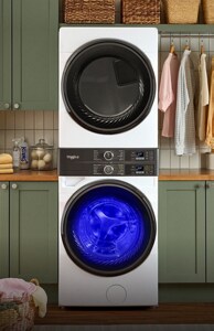A stacked laundry set in a laundry room