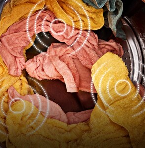 Wet clothes inside of a washing machine